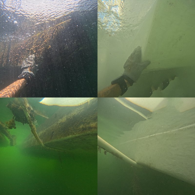 Underwater hull cleaning in progress